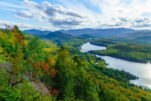 View of La Roche observation point, Monroe Lake and the park, with fall foliage colors in Mont Tremblant National Park, Quebec, Canada