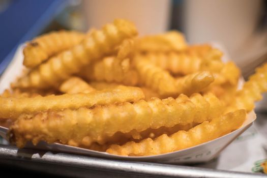 Macro shot of Screw shaped french fries toasted evenly and crunchy.