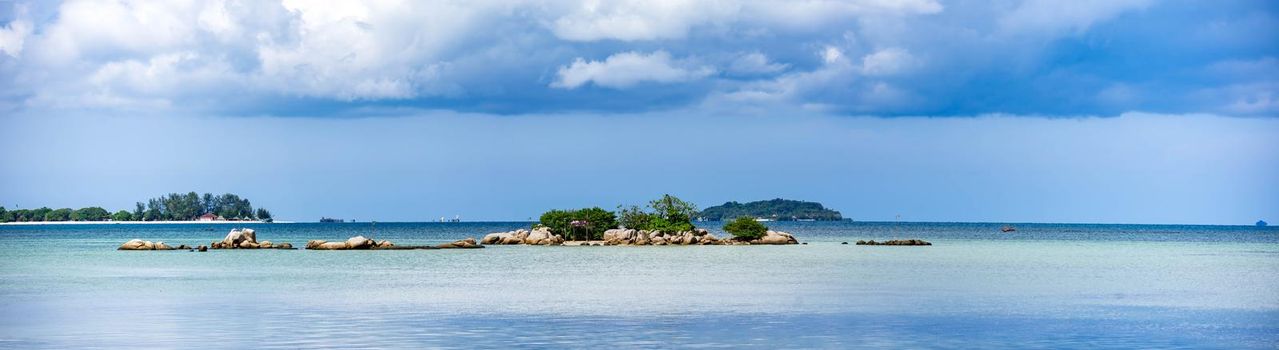 Panorama shot of bintan island with blue sky, clear ocean water and bueatiful islands