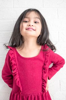 A Fashion model and beauty look. Stylish girl with pretty face on grey background. Hairdresser, skincare, casual style. Beauty and kid fashion with healthy hair. Little girl with long hair.