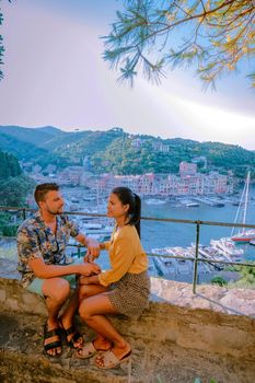 couple on vacation ligurian coast Italy,Portofino famous village bay, Italy Europe colorful village Ligurian coast