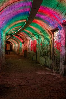  Utrecht Netherlands January 2021, colorful green, blue, pink illuminated Ganzemarkt tunnel in the center of Utrecht, The Netherlands