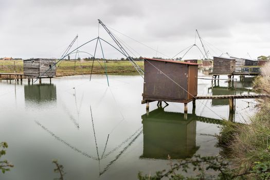 Carrelet de Pêche, the emblematic fisherman's hut of the coastal landscapes of Vendee, Charente-Maritime, in the estuary of La Gironde, La Charente, La Loire or in the Marais Poitevin