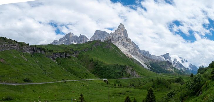 Pale di San Martino from Baita Segantini - Passo Rolle italy,Couple visit the italian Alps, View of Cimon della Pala, the best-know peak of the Pale di San Martino Group in the Dolomites, northern Italy Europe