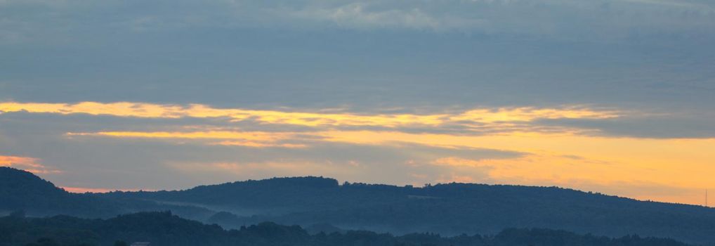 Sunset on small hills in western New York state