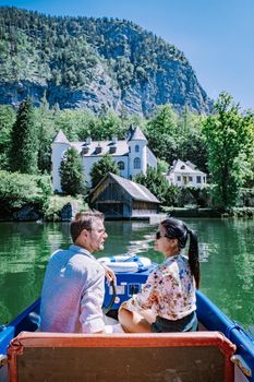 couple visit during summer vacation Hallstatt village on Hallstatter lake in Austrian Alps Austria Europe