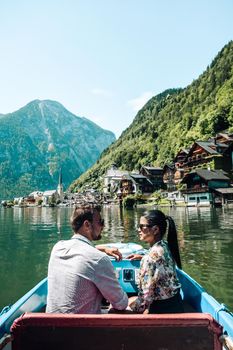 couple visit during summer vacation Hallstatt village on Hallstatter lake in Austrian Alps Austria Europe