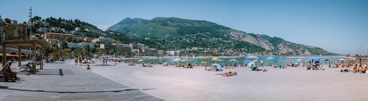 Menton France,Cote d Azur June 2020, Warm hot summer day at the beach and a View on old part of Menton, Provence-Alpes-Cote d'Azur, France Europe