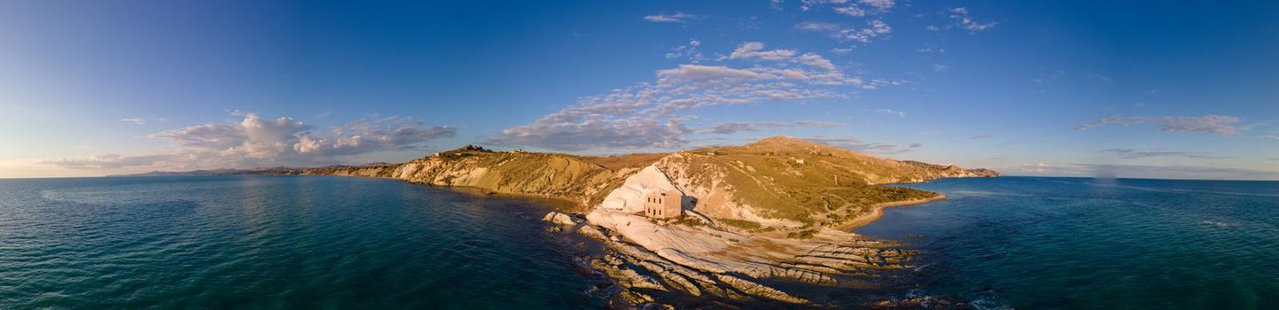 Punta Bianca, Agrigento in Sicily Italy White beach with old ruins of an abandoned stone house on white cliffs Sicilia Italy. 