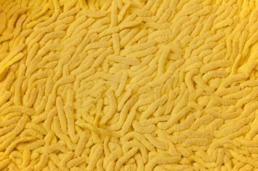 Big yellow highlighted with a textured surface Mat for the bathroom.Texture or background