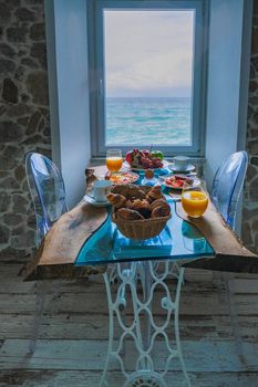 breakfast with a view over the ocean from the window,Cefalu, medieval village of Sicily island, Province of Palermo, Italy. Europe