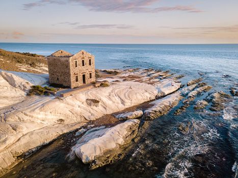 Punta Bianca, Agrigento in Sicily Italy White beach with old ruins of an abandoned stone house on white cliffs. Sicilia Italy, couple on vacation in Italy