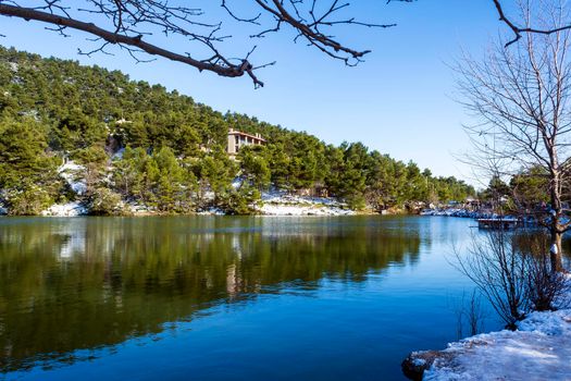 Photo of Lake Beletsi covered in snow, Ipokrateios politeia, Parnitha, Attica, Greece.