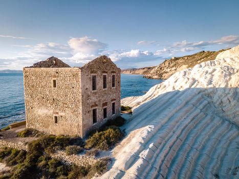 Punta Bianca, Agrigento in Sicily Italy White beach with old ruins of an abandoned stone house on white cliffs. Sicilia Italy, couple on vacation in Italy