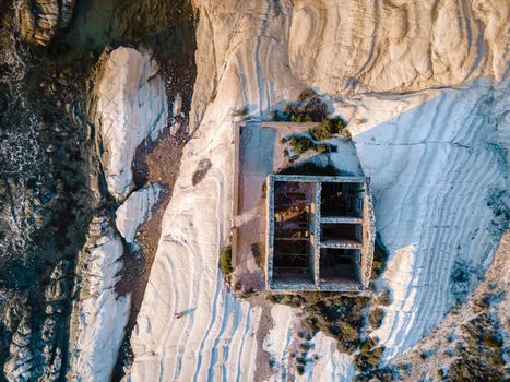 Punta Bianca, Agrigento in Sicily Italy White beach with old ruins of an abandoned stone house on white cliffs. Sicilia Italy, couple on vacation in Italy