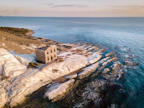 Punta Bianca, Agrigento in Sicily Italy White beach with old ruins of an abandoned stone house on white cliffs. Sicilia Italy, couple on vacation in Italy