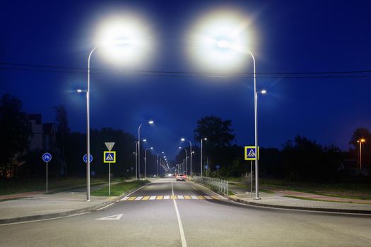 empty brightly lit new modern motorway at night
