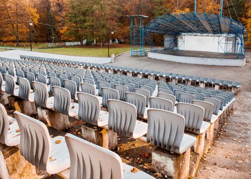 empty outdoor concert hall in city park on sunny autumn day