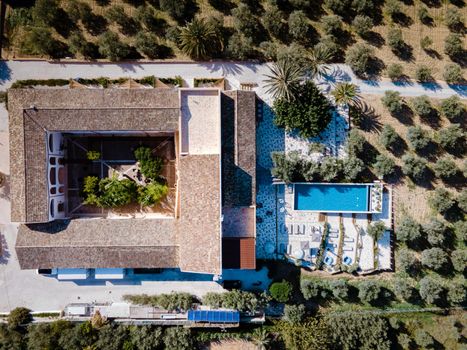 Luxury resort with a view over the wine field in Selinunte Sicily Italy. infinity pool with a view over wine fields in Sicilia, a couple on luxury vacation at the Island of Sicily Italy