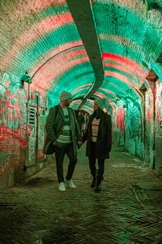  Utrecht Netherlands January 2021, colorful green, blue, pink illuminated Ganzemarkt tunnel in the center of Utrecht, The Netherlands