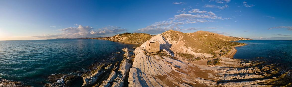 Punta Bianca, Agrigento in Sicily Italy White beach with old ruins of an abandoned stone house on white cliffs Sicilia Italy. 