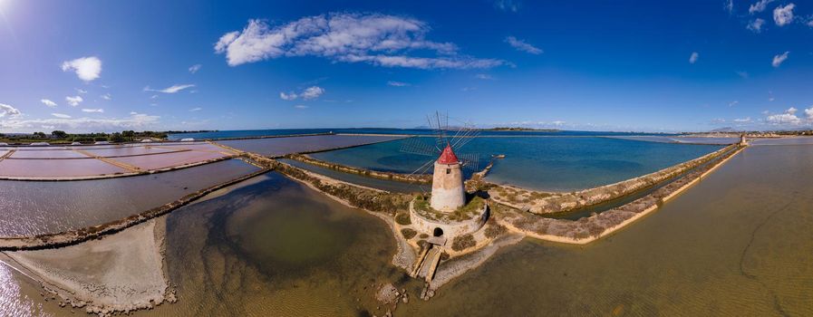 Salt Pans near Marsala, Sicily, Italy, Saline of the Laguna Marsala with a windmill. Sicily, Italy