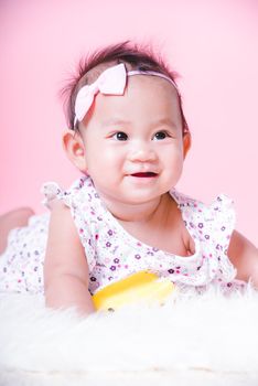 Asian girl cute baby smiling face on pink background