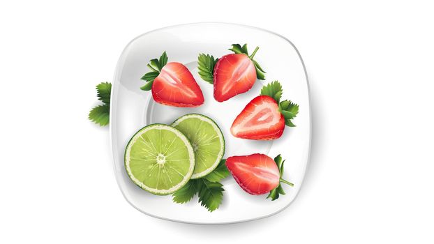 Beautiful composition of the sliced lime and strawberries with leaves.