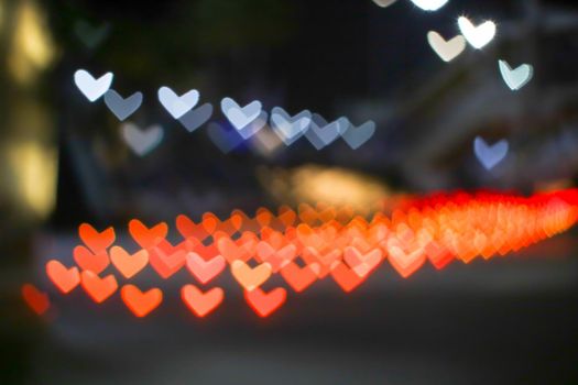 orange bokeh and blur heart shape love valentine colorful night light