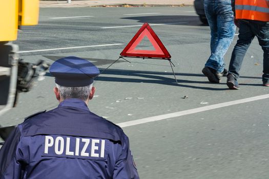 German police, locking and securing a crime scene.