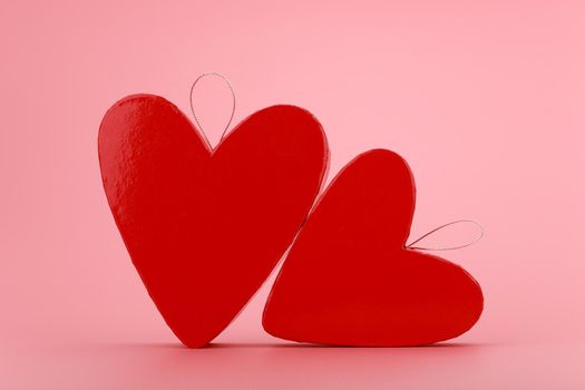Still life with two heart shaped gift boxes on bright pink background. Concept of St. Valentine's day. High quality photo