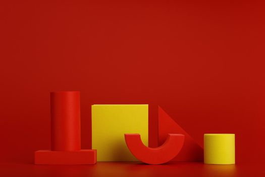 Minimalistic still life with red and yellow geometric figures with copy space. High quality photo