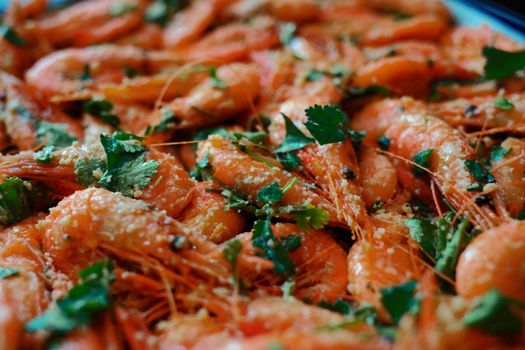 Fresh boiled prawns with coriander. A delicious dish of seafood