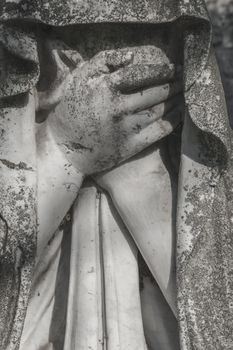 Old White marble statue of woman crying. Despair.