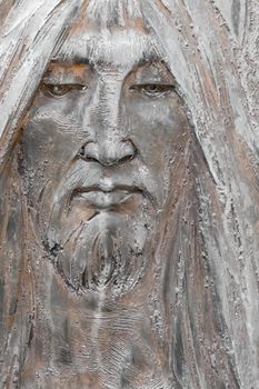 Bronze bas-relief of Jesus. Antique statue of Jesus Christ face. Religion, vintage, faith, history, suffering concept.