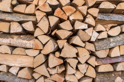 Stacked wooden logs shaping a background image.