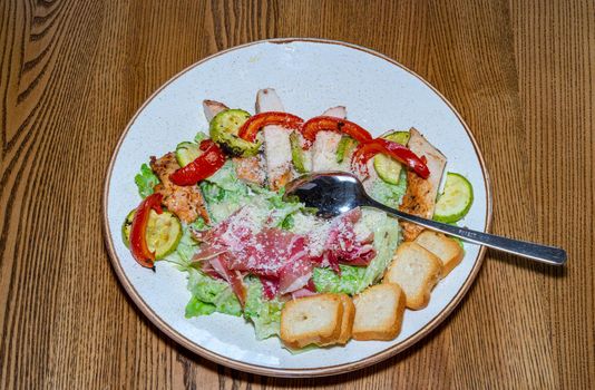 Delicious and healthy salad with meat and fresh vegetables