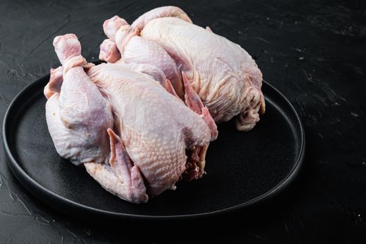 Fresh raw chicken meat, on black background