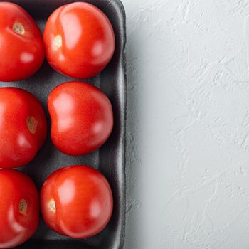 Fresh red organic tomatoes, on white background with copy space for text