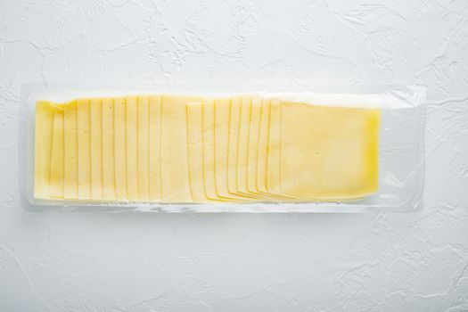 Slices of american cheese plastic pack, on white background