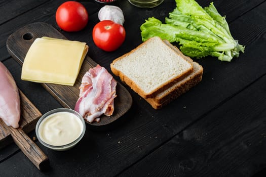 Fresh ingredient for tasty sandwich, on black wooden table with copy space for text