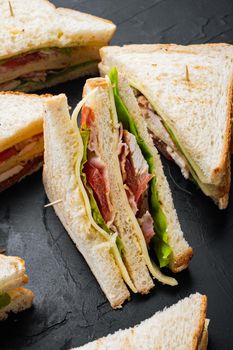 Deli fresh sandwich with chicken, on black background