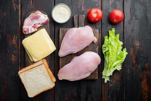 Delicious sandwich with toasted bread ingredient, on dark wooden background, top view