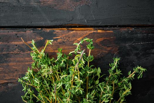 Thyme green fresh bunch, on old wooden table, top view