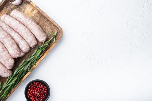 Traditional chicken sausages, top view with space for text, on white background.