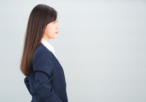 Portrait of asian businesswoman isolated on gray background