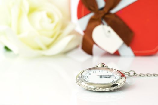 White rose and heart-shaped box on white background, Valentine'sDay concept