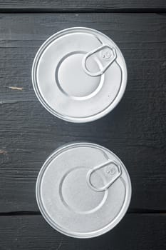 Canned dip tin can, on black wooden background, top view or flat lay