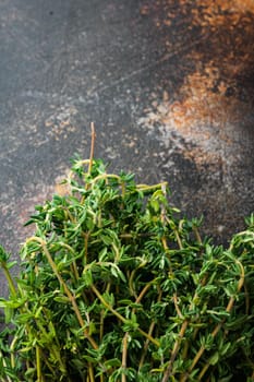 Thyme green bunch, on old rustic background, top view with copy space for text
