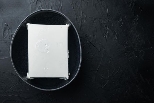 Fresh greek feta cheese set, on black background, flat lay with copy space for text
